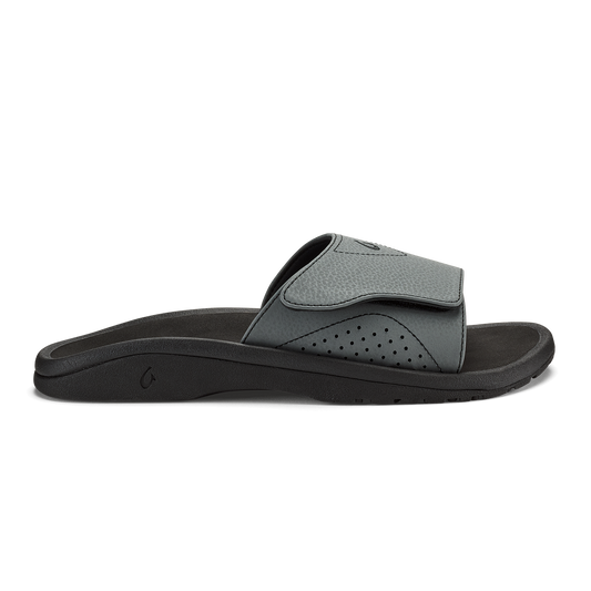 Nalu Slide with gray and black colorway, featuring a cushioned footbed and perforated upper strap.