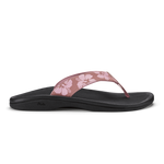 Coral rose flip-flop sandal with black sole and floral patterned upper strap.