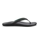 Black and dark green flip-flop sandal with textured footbed and thong strap, shown in side profile.